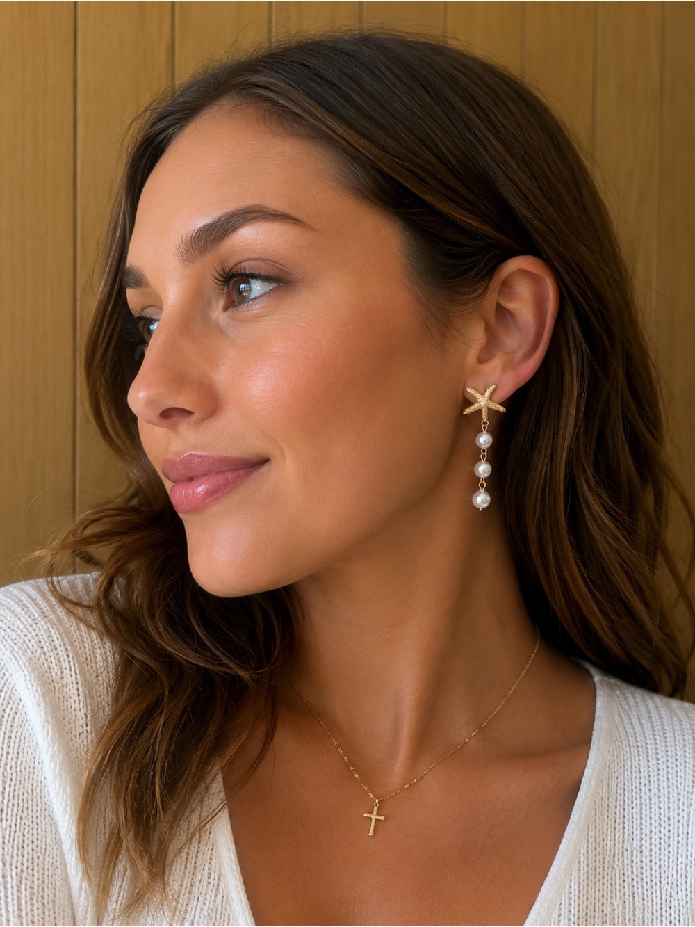 Gold starfish and pearl drop earrings